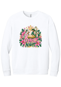 Artful O Holy Night crewneck sweatshirt in White, featuring a painted nativity under the star of Bethlehem with O Holy Night lettering framed by pink poinsettias and evergreen