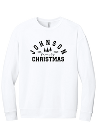 Personalized Family Christmas crewneck sweatshirt in White, featuring an arched family name over pine trees with EST. year and family Christmas lettering