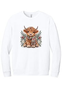 Highland Holidays crewneck sweatshirt in White, featuring a fluffy baby Highland cow in a Fair Isle knit scarf, surrounded by frosted eucalyptus, pine, red berries, and white Christmas roses