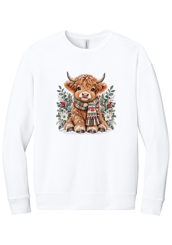 Highland Holidays crewneck sweatshirt in White, featuring a fluffy baby Highland cow in a Fair Isle knit scarf, surrounded by frosted eucalyptus, pine, red berries, and white Christmas roses