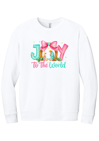Joy to the World Nativity crewneck sweatshirt in White, featuring painted JOY letters framing a nativity scene with a pink bow and To The World script