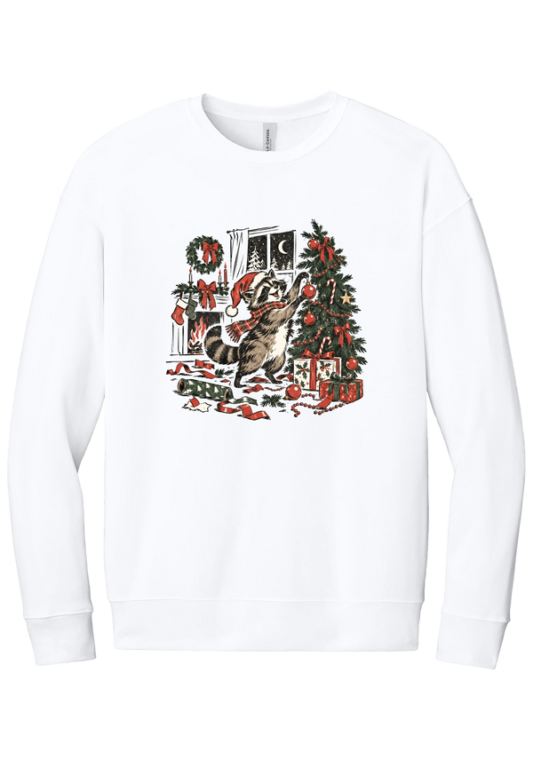 Raccoon Christmas crewneck sweatshirt in White, featuring a vintage-style raccoon in a Santa hat and plaid scarf decorating a Christmas tree by the fireplace with ribbon and gifts scattered around
