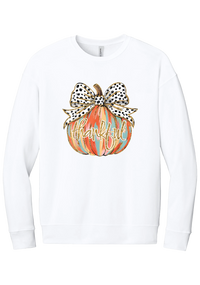 Thankful Pumpkin Bow crewneck sweatshirt in White, featuring a painted pumpkin with a spotted bow and thankful in gold glitter script