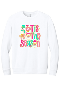 Tis the Season Snowman crewneck sweatshirt in White, featuring pink and teal TIS THE SEASON letters with a snowman, a cocoa mug, and Santas