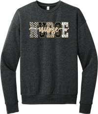 Glitzy Patterned Nurse crewneck sweatshirt in Dark Grey Heather, featuring NURSE block letters in checkerboard, leopard, and polka dot patterns with a gold glitter outline and nurse script