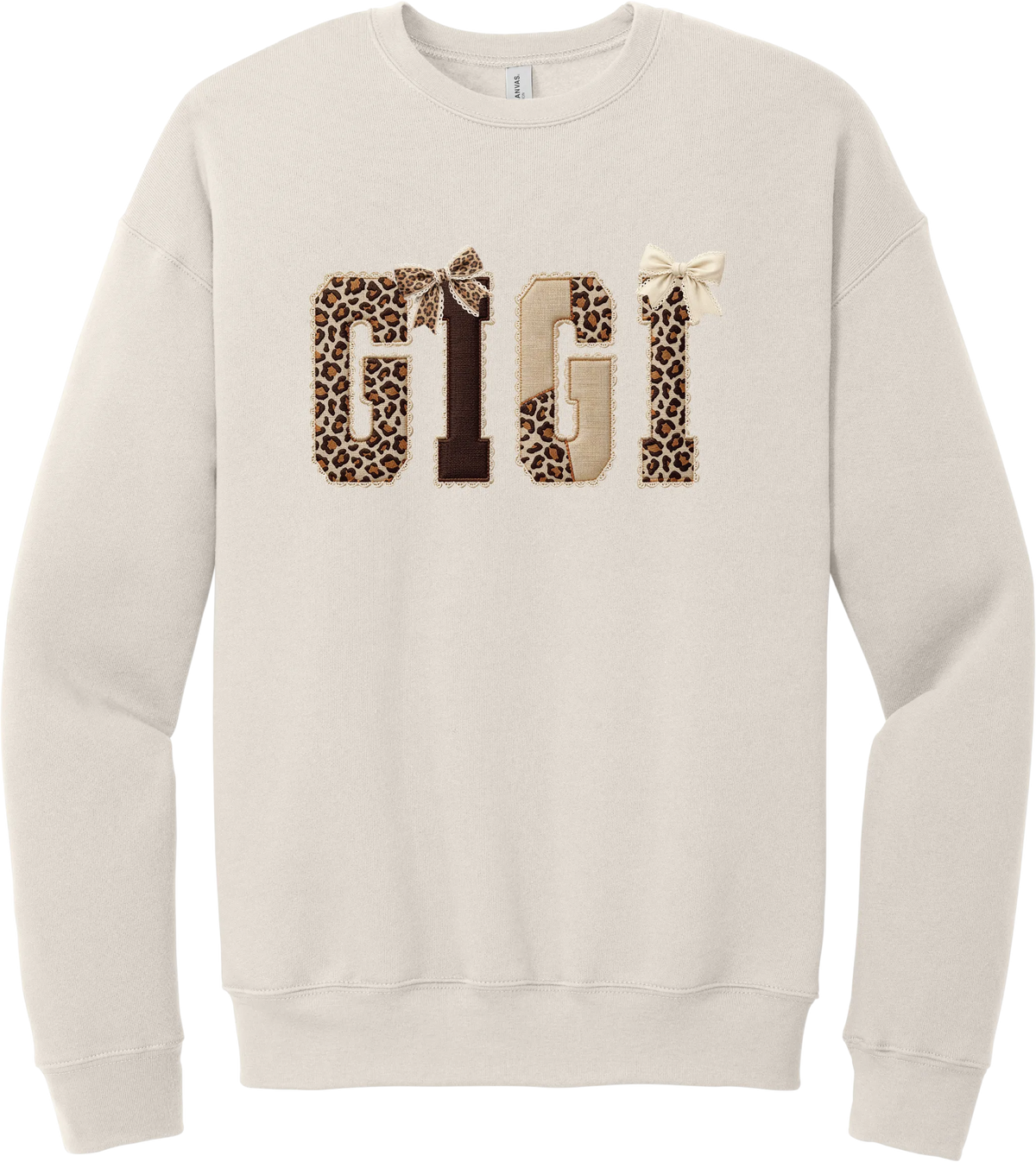 Grandma Leopard Applique crewneck sweatshirt in Heather Dust, featuring GIGI spelled out in leopard, cream, and chocolate patches with a scalloped stitched applique look and two bows