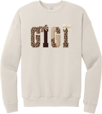 Grandma Leopard Applique crewneck sweatshirt in Heather Dust, featuring GIGI spelled out in leopard, cream, and chocolate patches with a scalloped stitched applique look and two bows