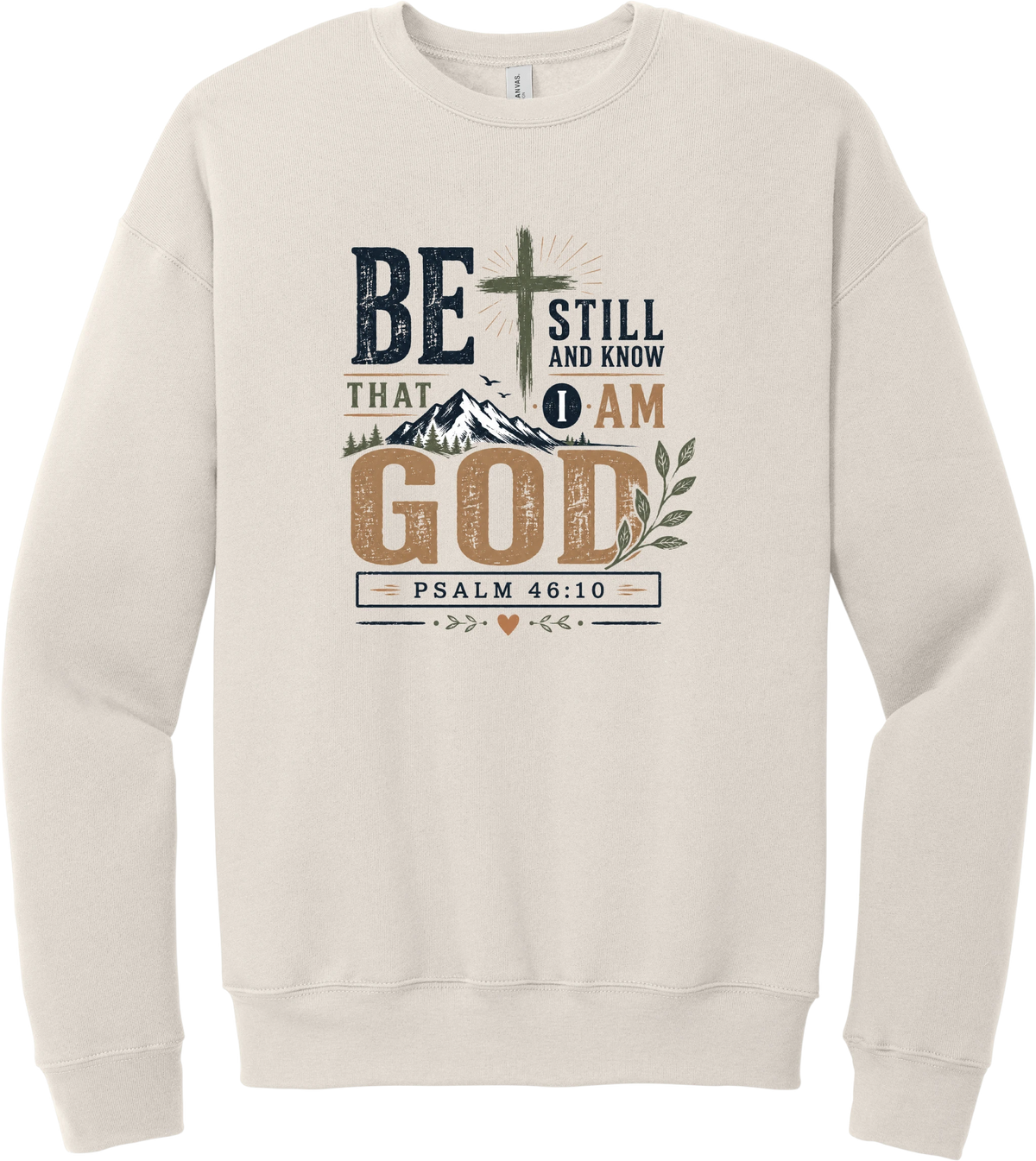Be Still and Know crewneck sweatshirt in Heather Dust, featuring Be Still and Know That I Am God lettering with a cross over mountains and Psalm 46:10