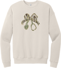 Camo Bow Stethoscope crewneck sweatshirt in Heather Dust, featuring a glittery camo print coquette bow tied to a sage green stethoscope