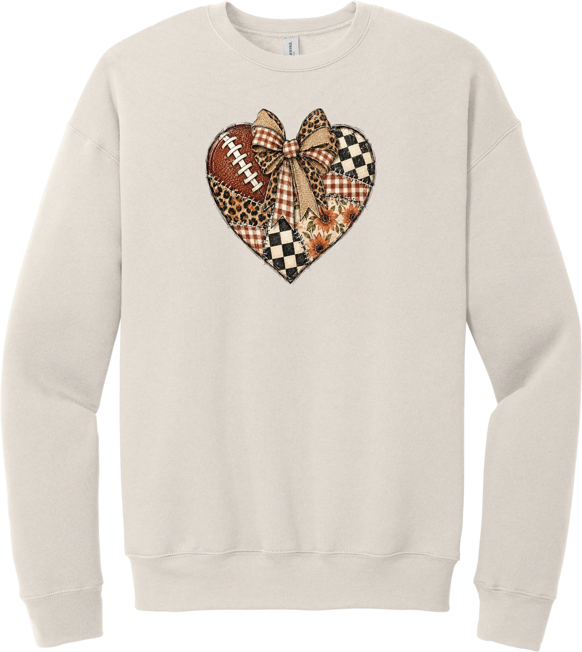 For the Love of Football crewneck sweatshirt in Heather Dust, featuring a patchwork heart in leopard, plaid, and checkerboard with a football and a cream bow
