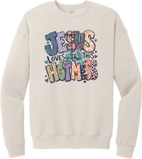 Jesus Loves This Hot Mess crewneck sweatshirt in Heather Dust, featuring patchwork Jesus Loves This Hot Mess lettering in leopard, plaid, polka dot, and zebra prints with a bow and hearts