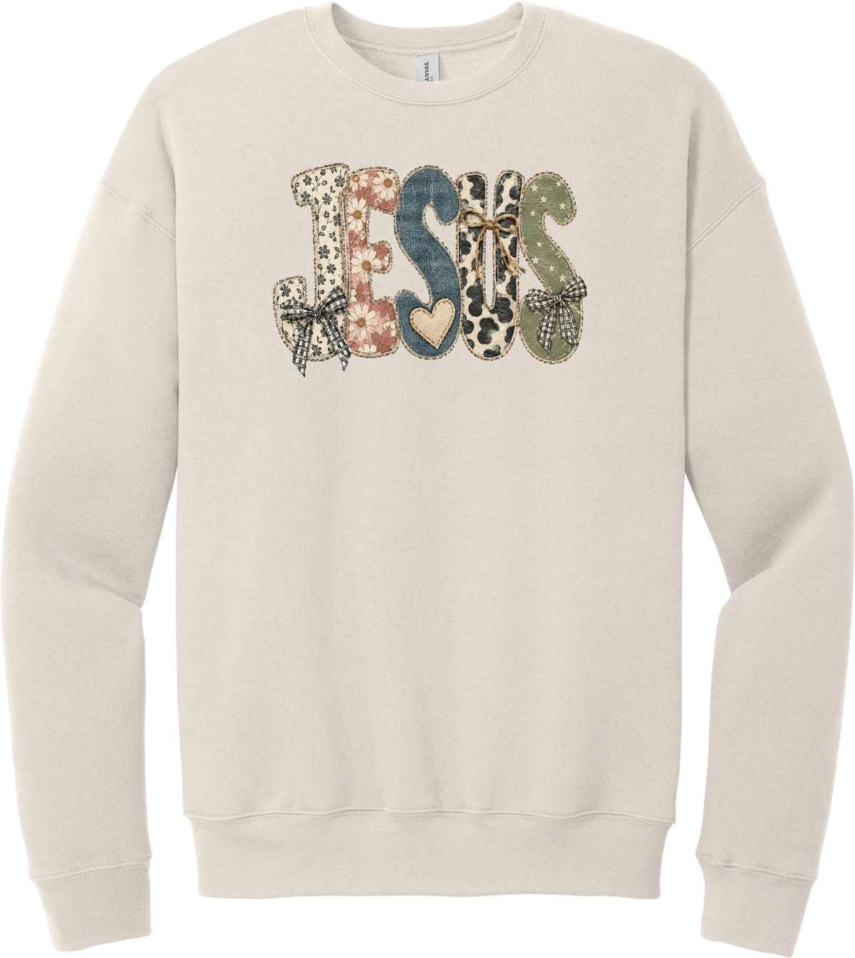 Jesus Patchwork crewneck sweatshirt in Heather Dust, featuring JESUS in patchwork letters of floral, leopard, denim, and cow print with gingham bows and a heart