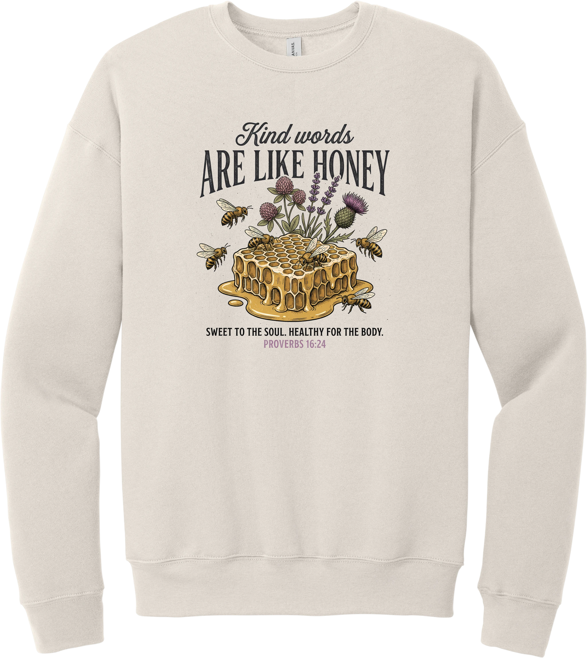 Words Like Honey crewneck sweatshirt in Heather Dust, featuring a dripping honeycomb with bees and wildflowers under Kind Words Are Like Honey lettering and Proverbs 16:24