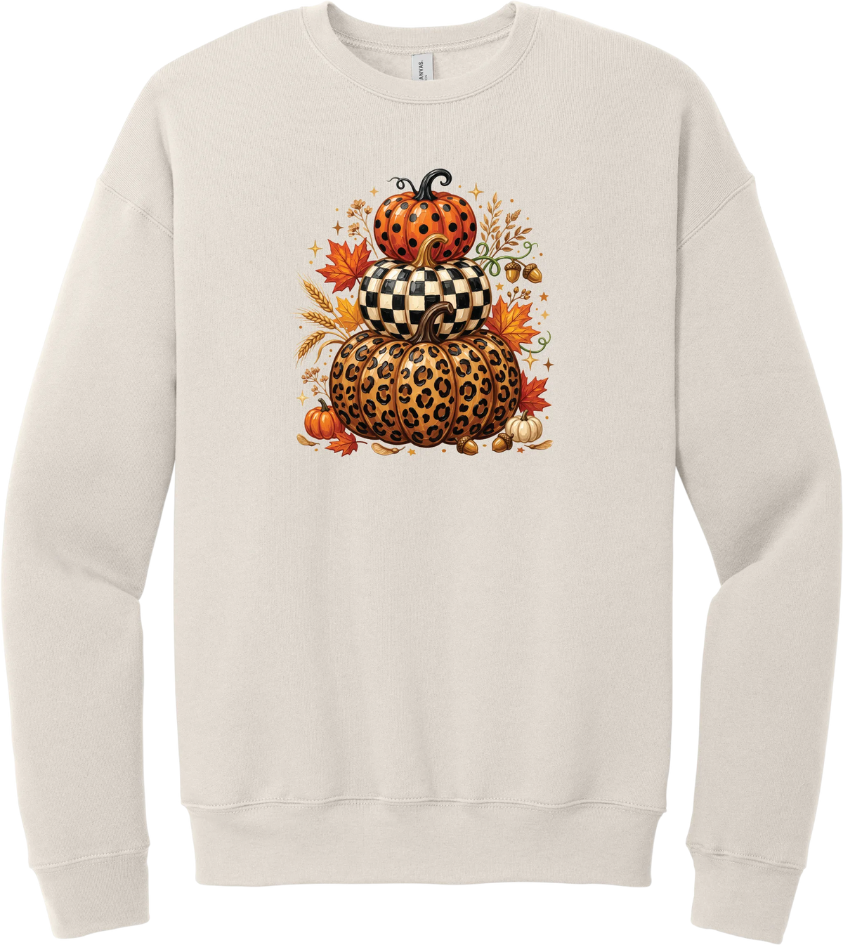 All Stacked Up crewneck sweatshirt in Heather Dust, featuring three stacked pumpkins in polka dot, checkerboard, and leopard with autumn leaves