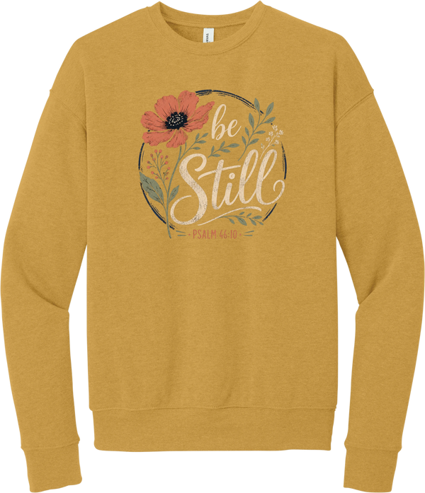 Be Still crewneck sweatshirt in Heather Mustard, featuring Be Still in hand lettered script with a coral poppy, greenery, and Psalm 46:10