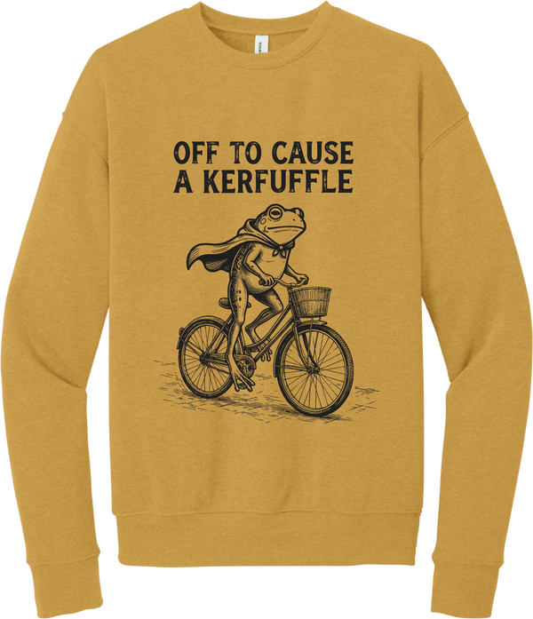 Off to Cause a Kerfuffle crewneck sweatshirt in Heather Mustard, featuring a caped frog riding a vintage bicycle with Off to cause a kerfuffle