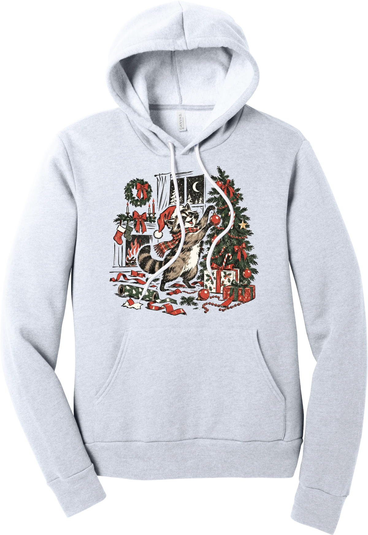 Raccoon Christmas hoodie in Ash, featuring a vintage-style raccoon in a Santa hat and plaid scarf decorating a Christmas tree by the fireplace with ribbon and gifts scattered around