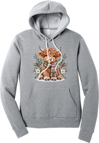 Highland Holidays hoodie in Athletic Heather, featuring a fluffy baby Highland cow in a Fair Isle knit scarf, surrounded by frosted eucalyptus, pine, red berries, and white Christmas roses