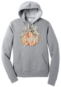 Thankful Pumpkin Bow hoodie in Athletic Heather, featuring a painted pumpkin with a spotted bow and thankful in gold glitter script