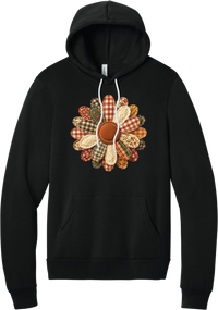 Patchwork Fabric Flower hoodie in Black, featuring an oversized fabric flower with plaid, gingham, calico, and cable knit petals around a stitched rust center