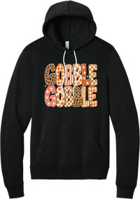 Gobble Gobble Patchwork hoodie in Black, featuring Gobble Gobble in bubble letters filled with leopard, gingham, checkerboard, stars, and pumpkin prints