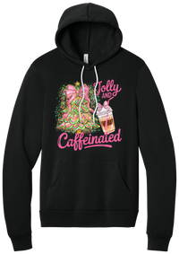 Jolly and Caffeinated hoodie in Black, featuring a pink bow Christmas tree and an iced coffee with Jolly and Caffeinated script