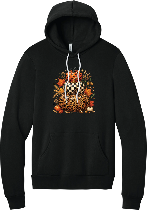 All Stacked Up hoodie in Black, featuring three stacked pumpkins in polka dot, checkerboard, and leopard with autumn leaves