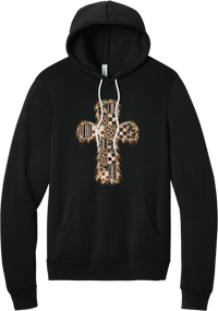 Quilted Patchwork Cross hoodie in Black, featuring a patchwork cross in camo, leopard, checkerboard, polka dot, and stripes with a fringed edge