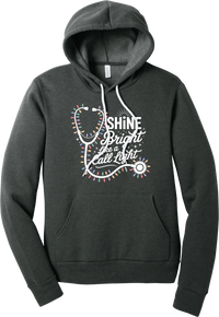 Shine Bright Like a Call Light hoodie in Dark Grey Heather, featuring a white stethoscope wrapped in multicolor Christmas lights with Shine Bright Like a Call Light lettering and sparkles