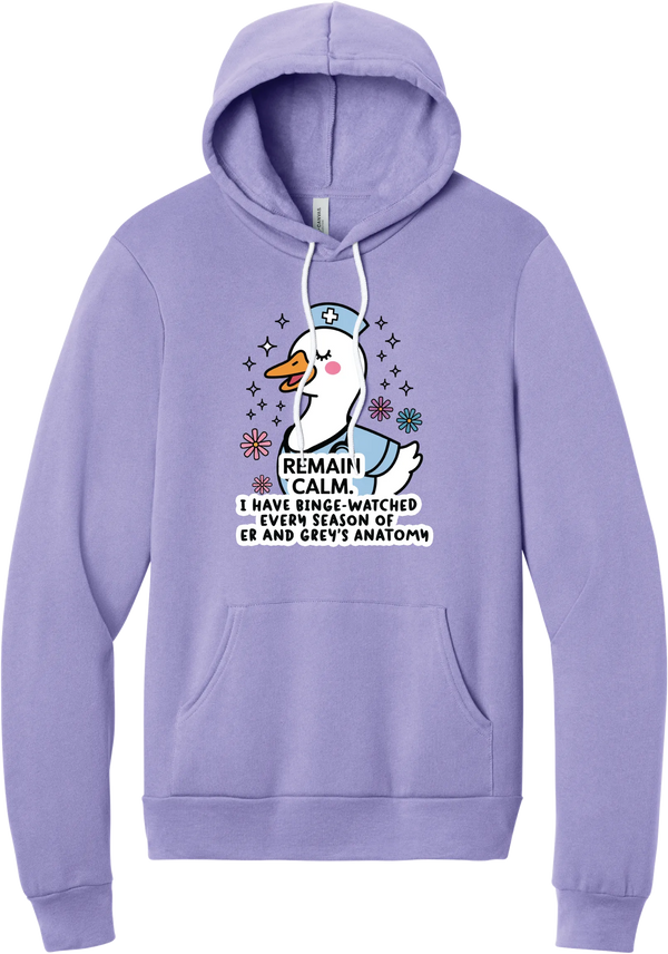 Remain Calm Nurse hoodie in Dark Lavender, featuring a smiling nurse goose in a cap and scrubs with sparkles and flowers above Remain Calm text