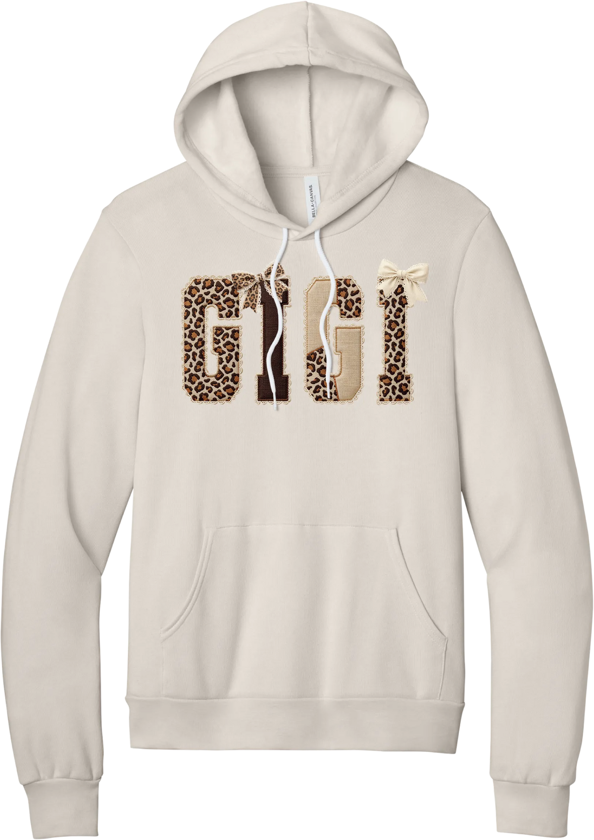 Grandma Leopard Applique hoodie in Heather Dust, featuring GIGI spelled out in leopard, cream, and chocolate patches with a scalloped stitched applique look and two bows