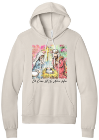 Adore Him Painted Nativity hoodie in Heather Dust, featuring a watercolor nativity of Mary, Joseph, and baby Jesus under a star with Oh Come Let Us Adore Him script
