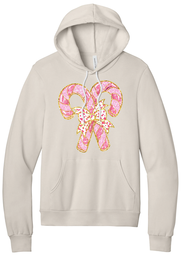 Candy Cane Bow hoodie in Heather Dust, featuring two pink glitter candy canes tied with a leopard heart bow and gold trim