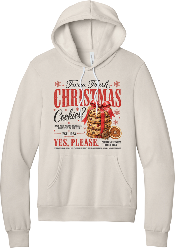 Farm Fresh Christmas Cookies hoodie in Heather Dust, featuring a vintage farmhouse bakery sign with a stack of Christmas cookies tied in a red bow, a dried orange slice, and red and black lettering