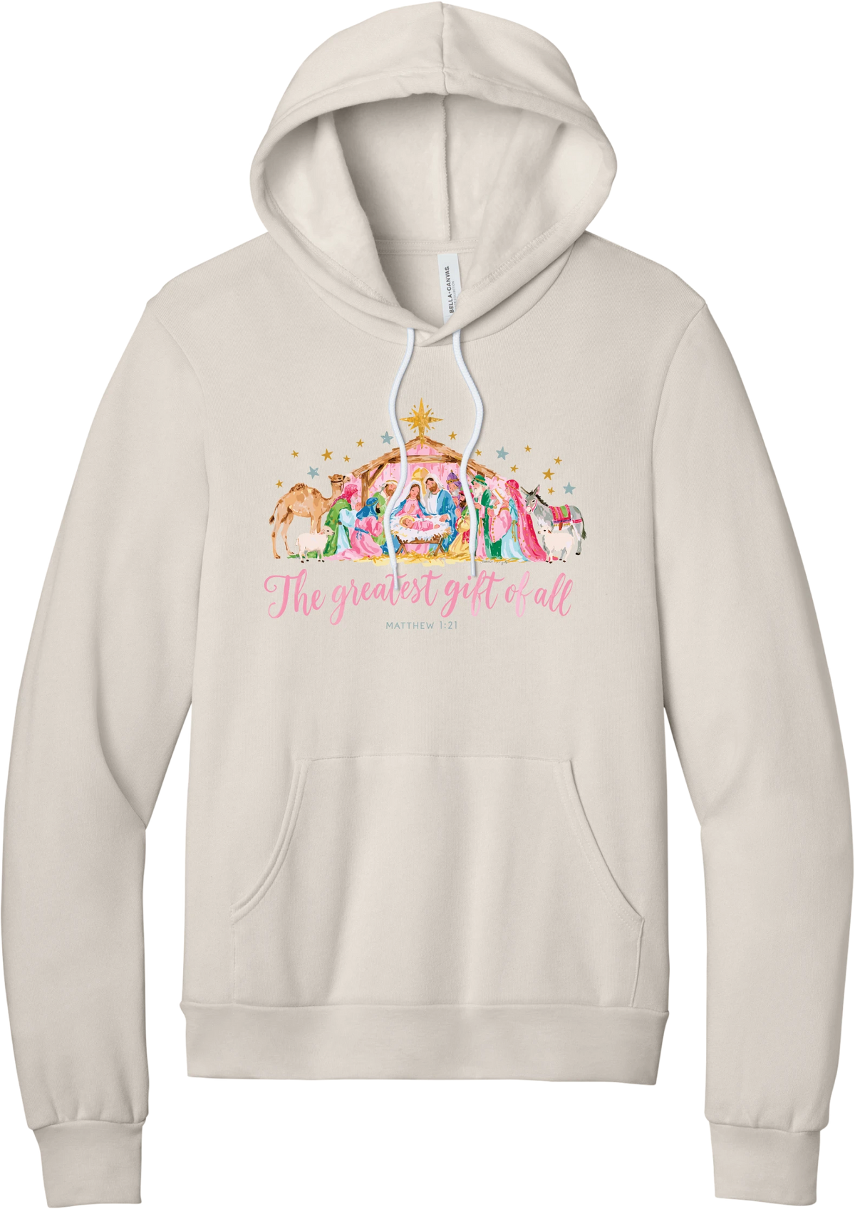 The Greatest Gift of All hoodie in Heather Dust, featuring a pastel watercolor nativity scene under the star with The Greatest Gift of All script and Matthew 1:21