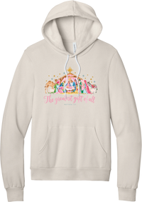 The Greatest Gift of All hoodie in Heather Dust, featuring a pastel watercolor nativity scene under the star with The Greatest Gift of All script and Matthew 1:21