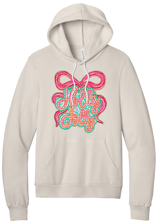 Holly Jolly Bow Script hoodie in Heather Dust, featuring pink gingham Holly Jolly script on a teal badge framed by a big pink bow