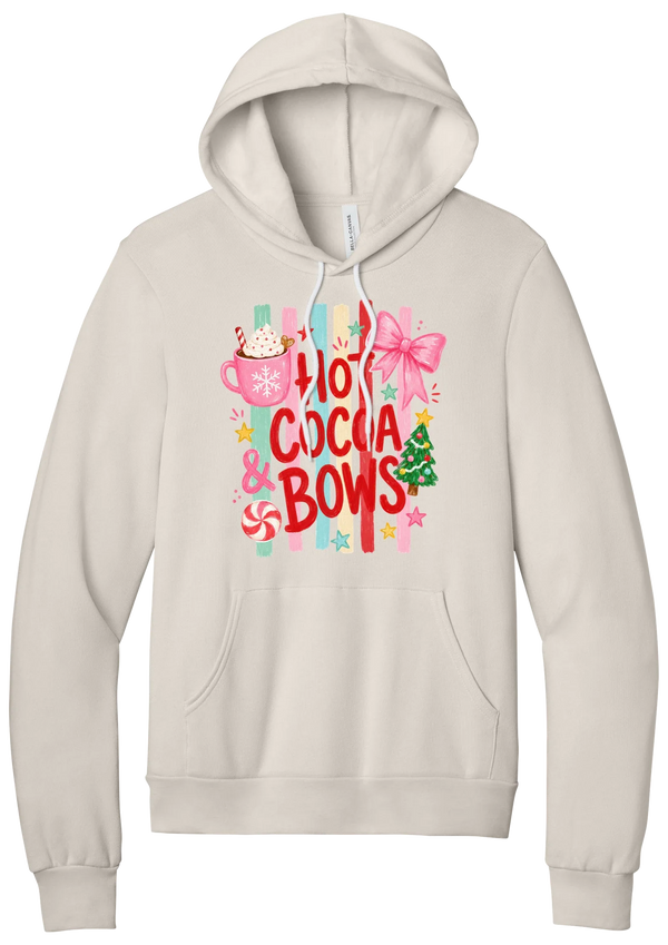 Hot Cocoa and Bows hoodie in Heather Dust, featuring red HOT COCOA and BOWS letters on pastel stripes with a cocoa mug and a pink bow
