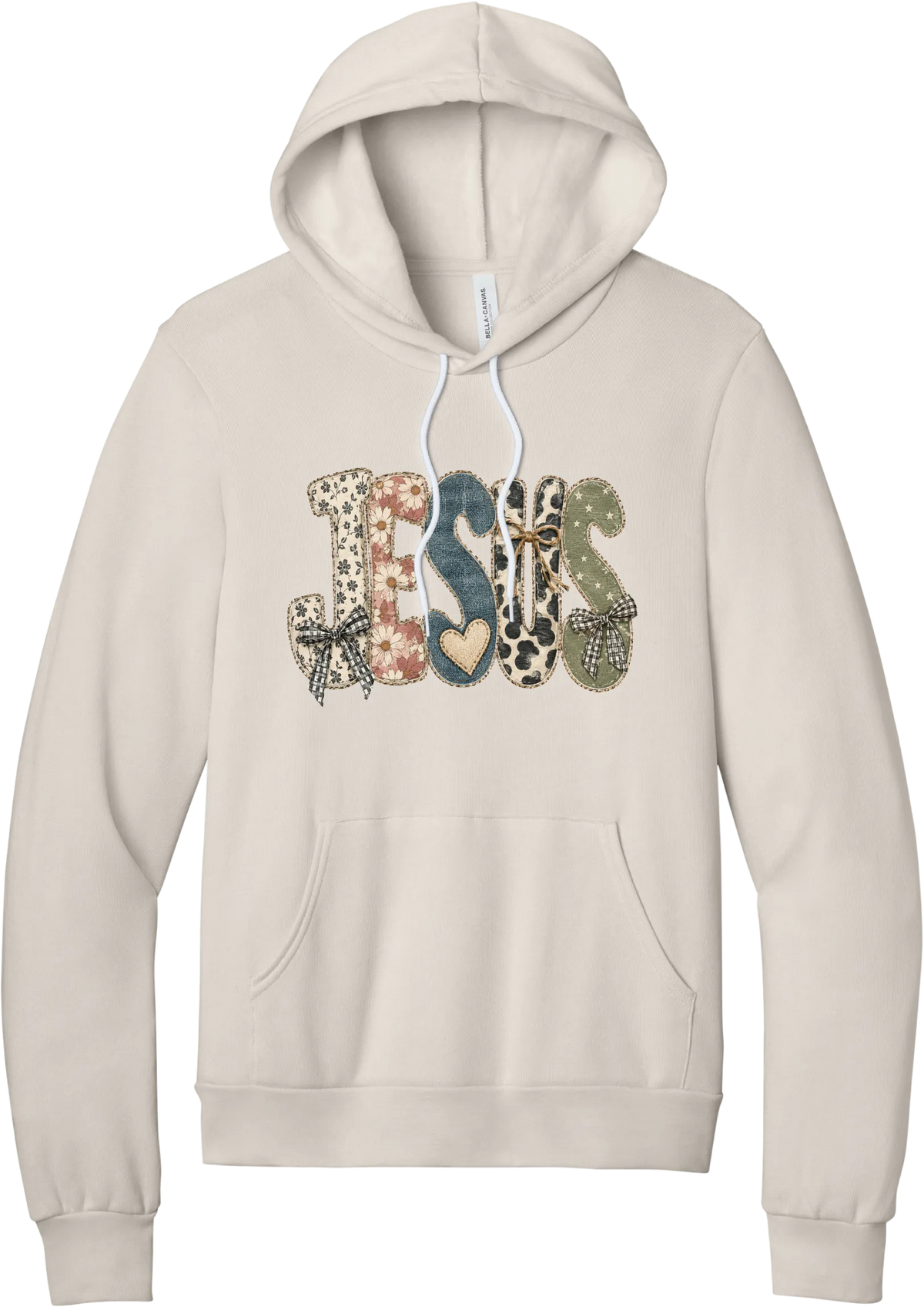 Jesus Patchwork hoodie in Heather Dust, featuring JESUS in patchwork letters of floral, leopard, denim, and cow print with gingham bows and a heart