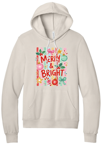 Merry and Bright Striped hoodie in Heather Dust, featuring red MERRY and BRIGHT letters on pink and green stripes with ornaments and holly
