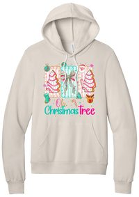 Oh Christmas Tree Cakes hoodie in Heather Dust, featuring frosted Christmas tree snack cakes on pink and mint panels over Oh Christmas Tree lettering