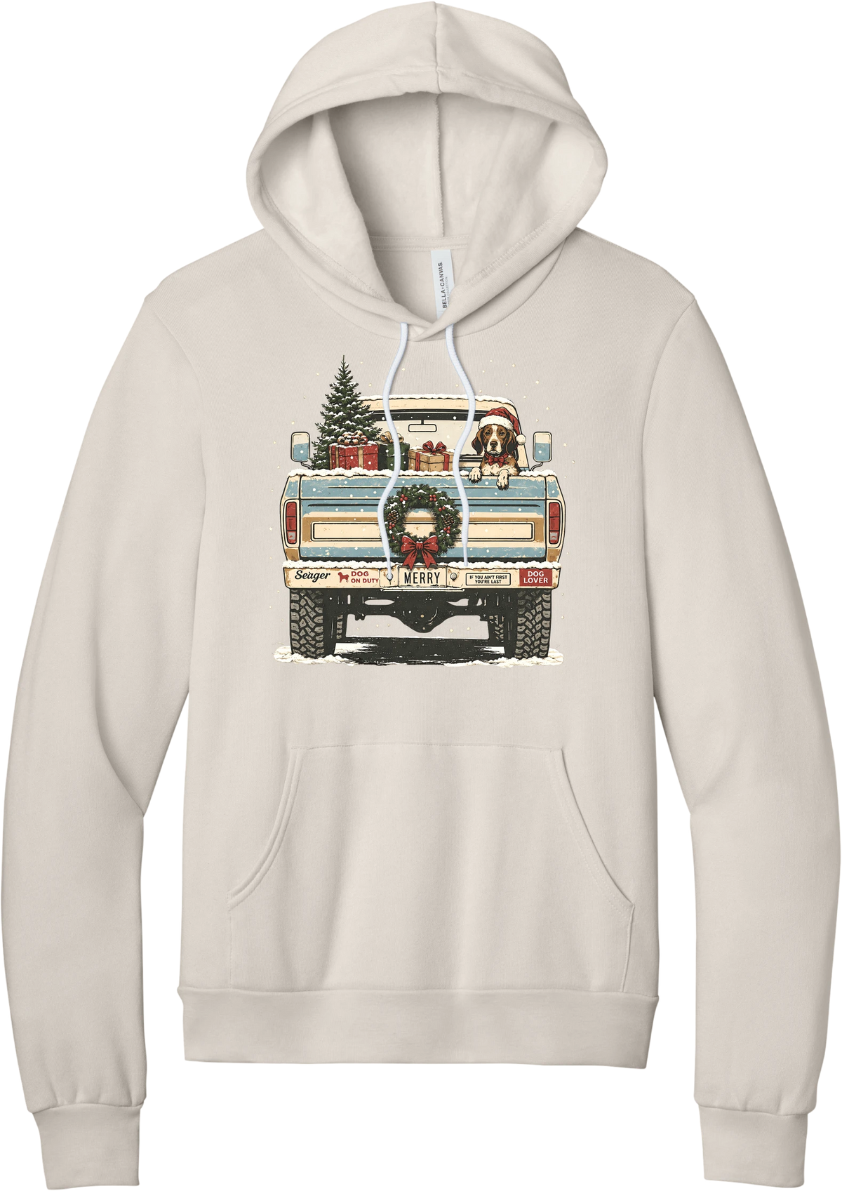 Christmas Pickup Truck with Dog hoodie in Heather Dust, featuring a vintage pickup truck with a Christmas tree, wrapped gifts, a tailgate wreath, and a dog in a Santa hat