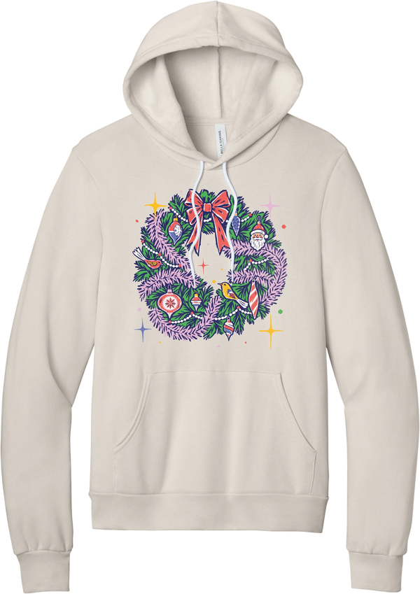 Retro Wreath hoodie in Heather Dust, featuring a retro tinsel Christmas wreath with vintage ornaments and a red bow