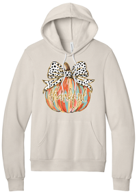 Thankful Pumpkin Bow hoodie in Heather Dust, featuring a painted pumpkin with a spotted bow and thankful in gold glitter script