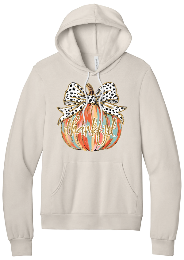 Thankful Pumpkin Bow hoodie in Heather Dust, featuring a painted pumpkin with a spotted bow and thankful in gold glitter script
