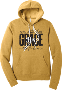 Even in the Chaos hoodie in Heather Mustard, featuring distressed GRACE lettering with His in script, framed by even in the chaos and still finds me
