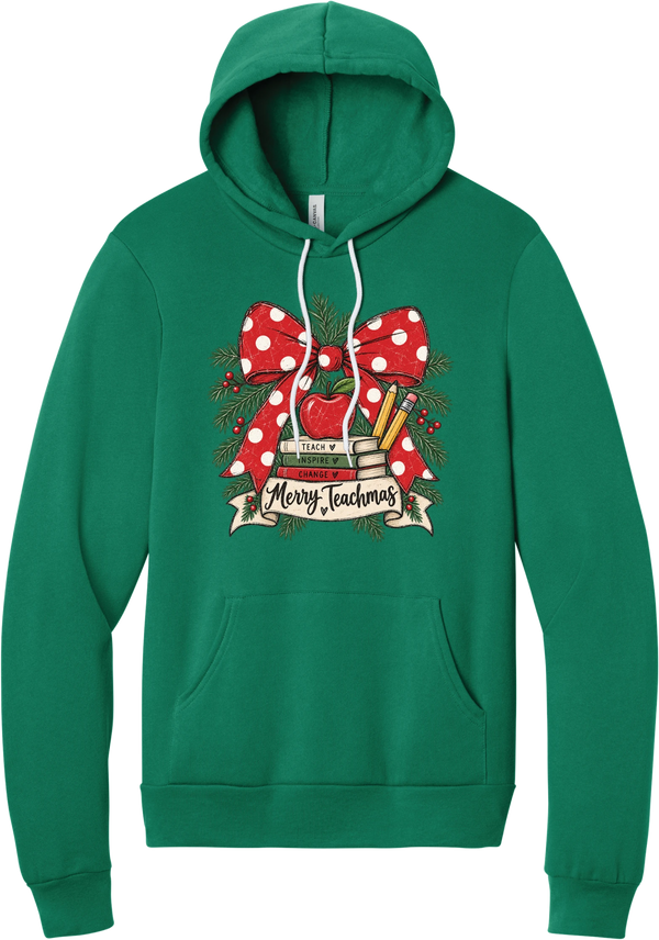 Merry Teachmas hoodie in Kelly Green, featuring a red polka dot bow over a stack of books reading Teach, Inspire, Change with an apple, pencils, evergreen, and a Merry Teachmas banner