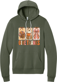 Give Thanks Coquette hoodie in Military Green, featuring three bow-topped stamp panels with a turkey, stacked pumpkins, and a pink bow above Give Thanks in patchwork letters