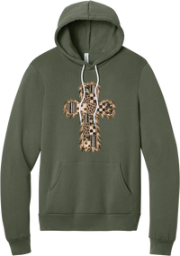 Quilted Patchwork Cross hoodie in Military Green, featuring a patchwork cross in camo, leopard, checkerboard, polka dot, and stripes with a fringed edge