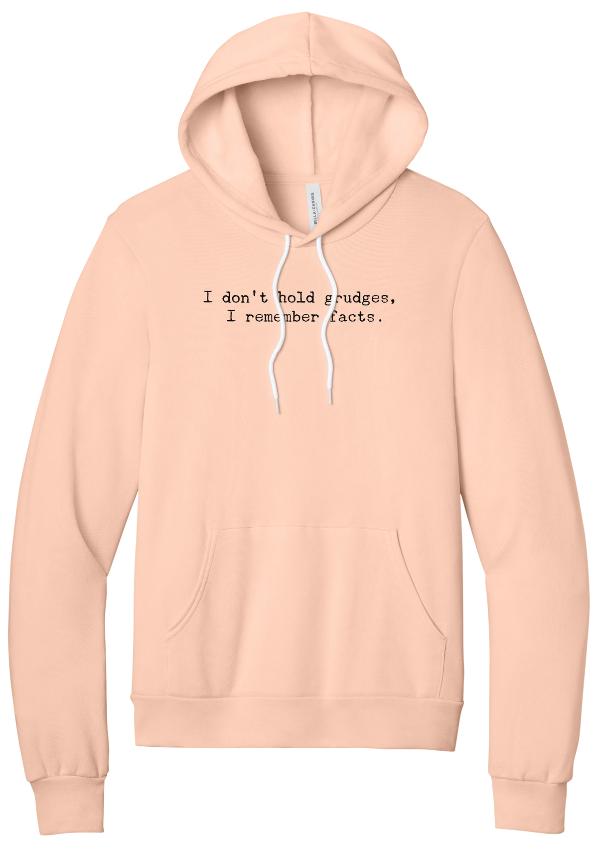 I Don't Hold Grudges hoodie in Peach, featuring I don't hold grudges, I remember facts in distressed black typewriter letters